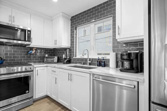 Beachside 3-Story Home with Patio and Rooftop Deck - Image 3