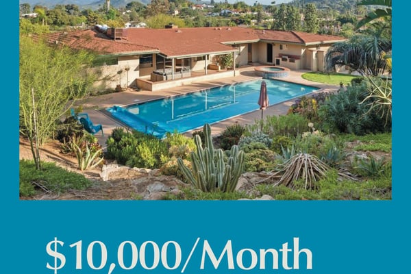 Mid-century home with terracotta roof, swimming pool, and desert landscaping overlooking mountains in El Cajon, California
